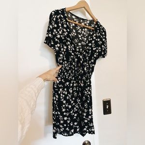 Black daisy print romper